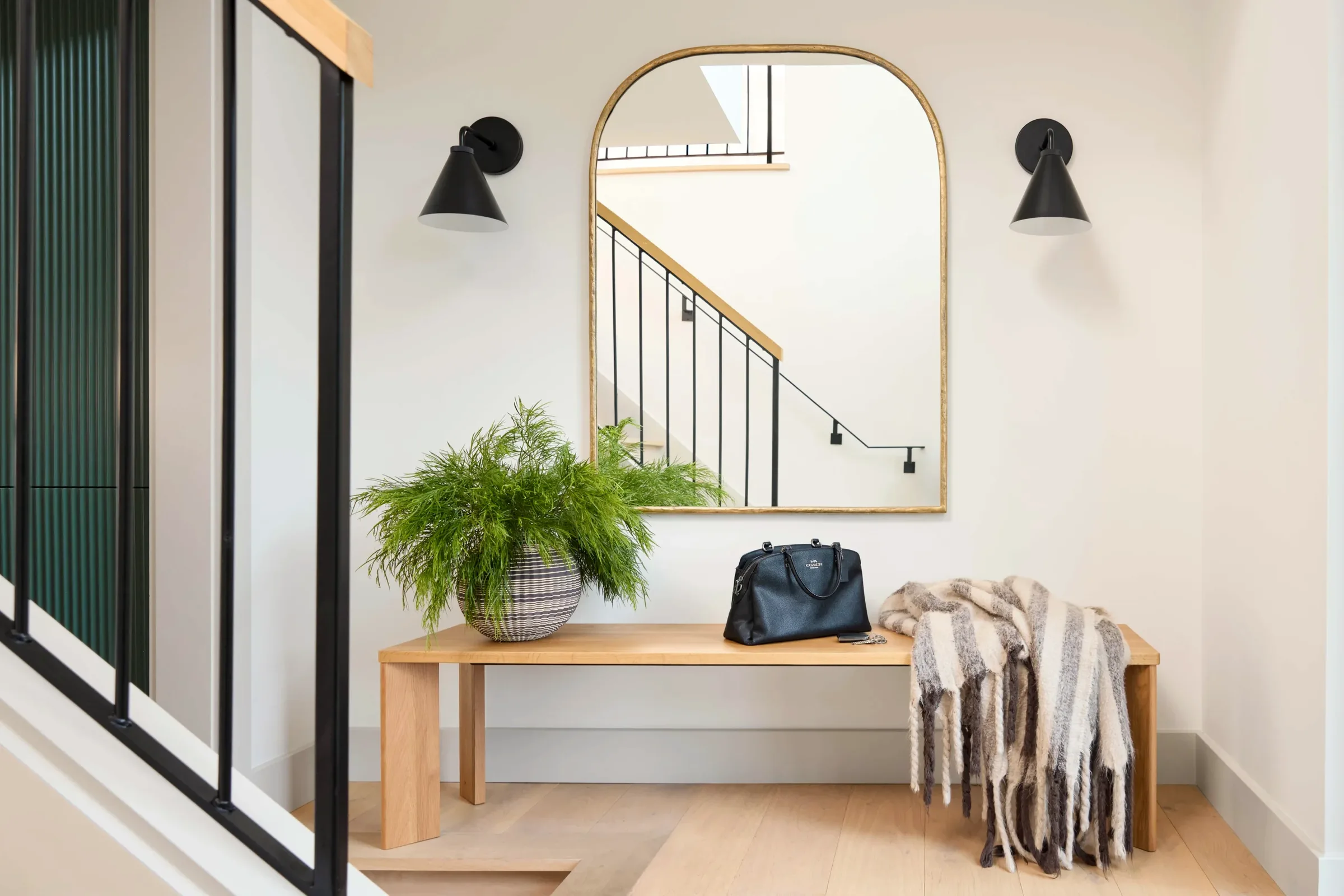 Entry at Quisisana, Kentfield, with bench, mirror, and stair