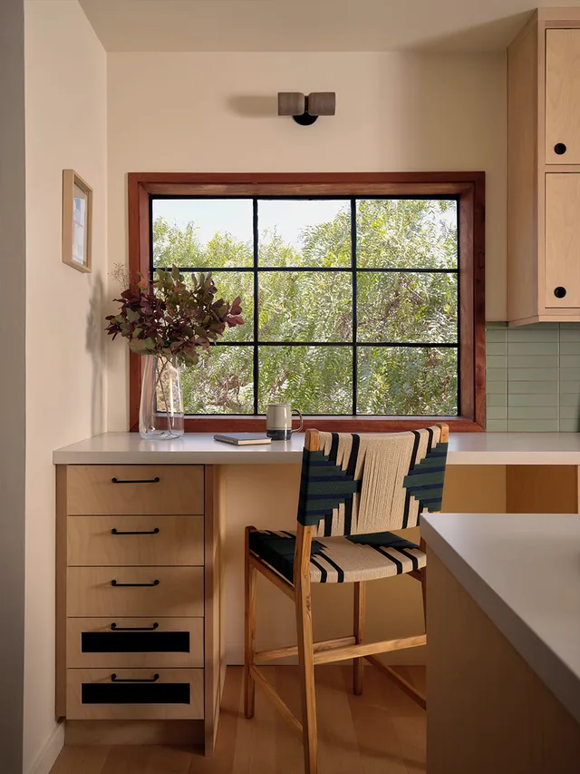 Breakfast bar with maple cabinets and a stone counter, close