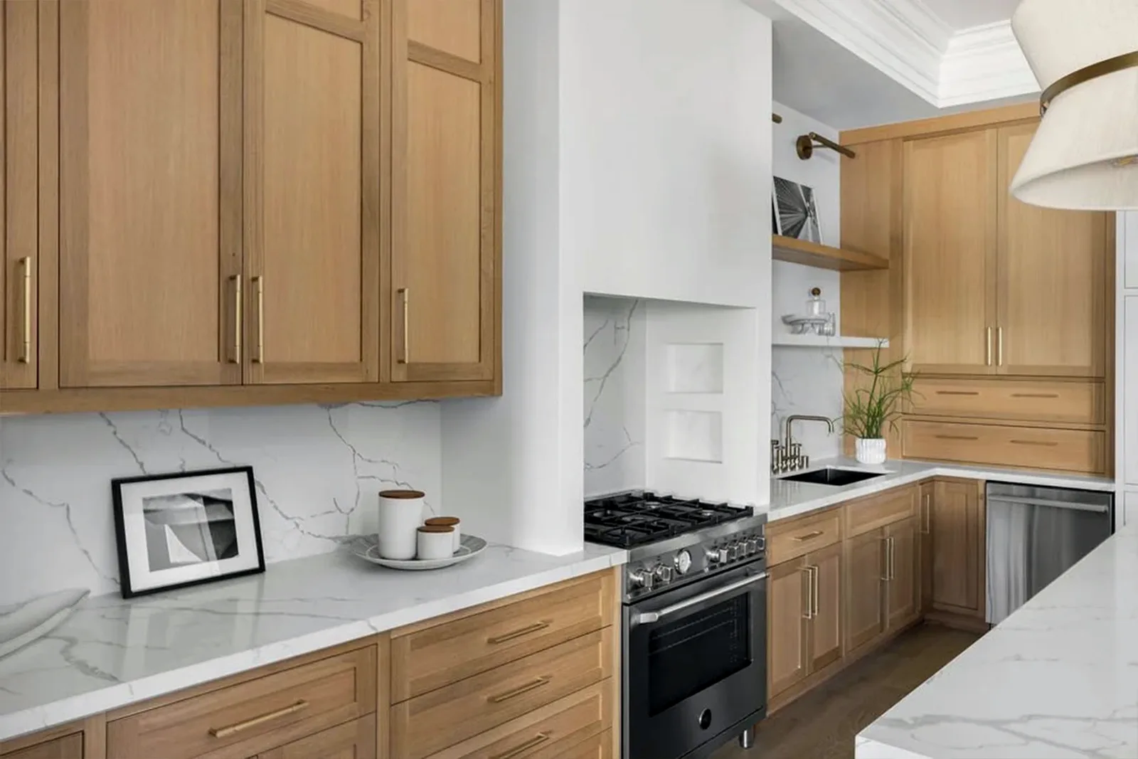 White oak cabinetry meeting the marble counter and backsplash